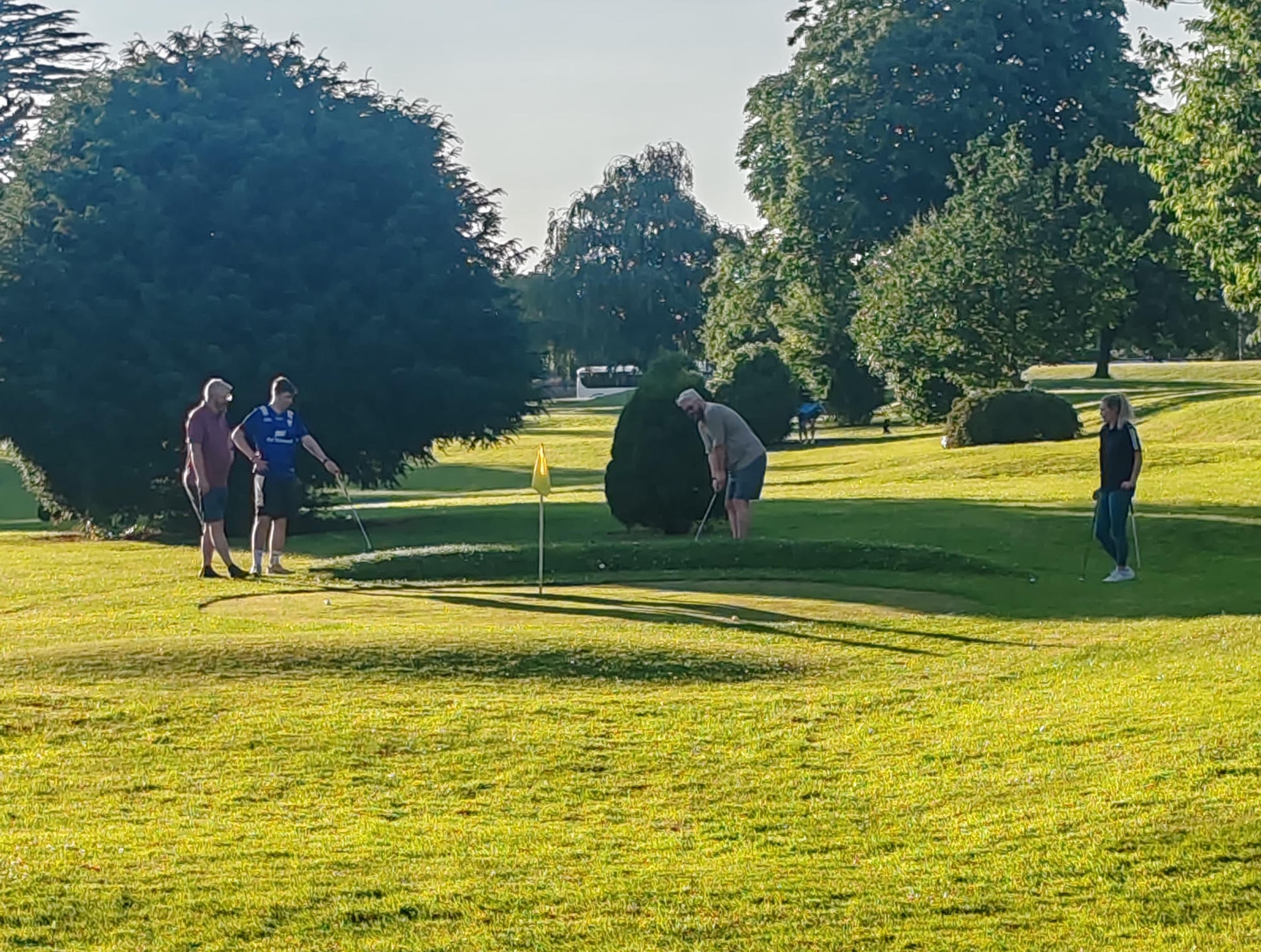 lacken pitch and putt club kilkenny course players in evening sun